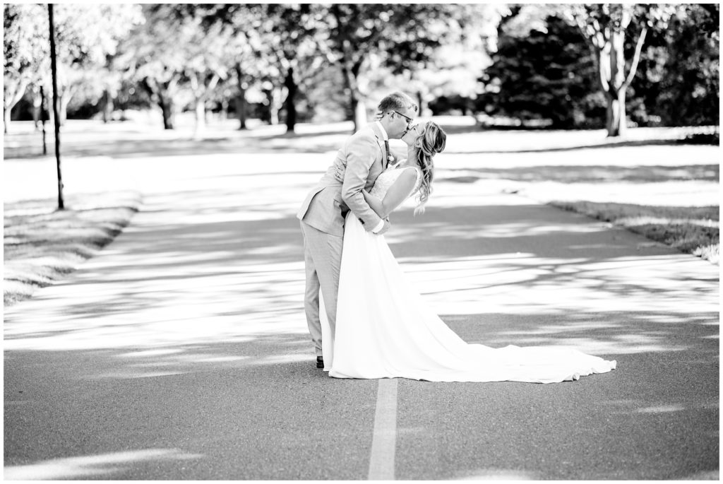 Aiden Laurette Photography | Ontario Wedding Photographer | London Hunt Club wedding | Wedding Couples photo- kissing in the road