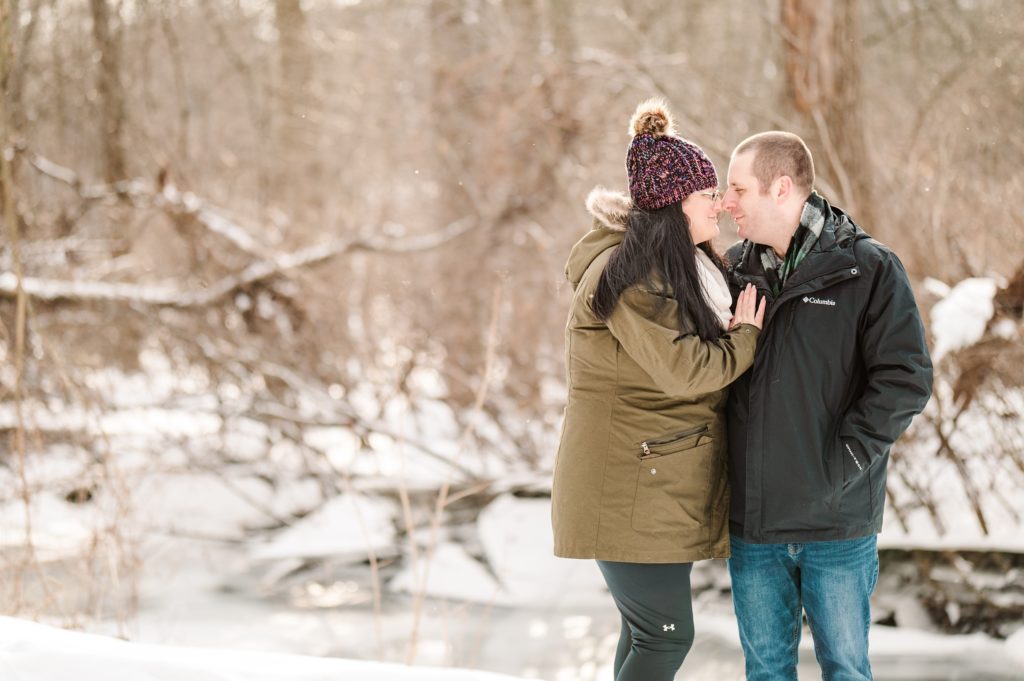 Ontario Engagement Portraits | Couple Kissing near the river