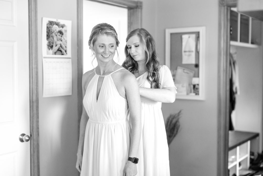 aiden laurette photography | black and white image of women getting ready for wedding