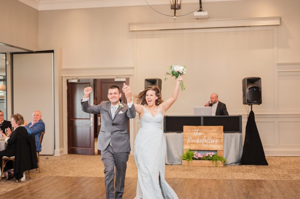 aiden laurette photography | bridesmaid and groomsman enter wedding reception hall
