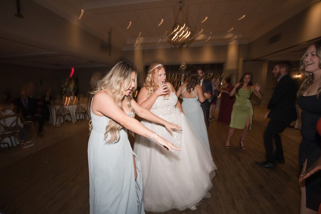 aiden laurette photography | bride dancing with group of women