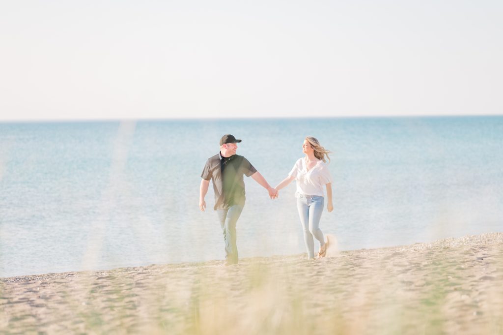 Aiden Laurette Photography | Beach Engagement Photos | Couple's Portrait  walking on the beach