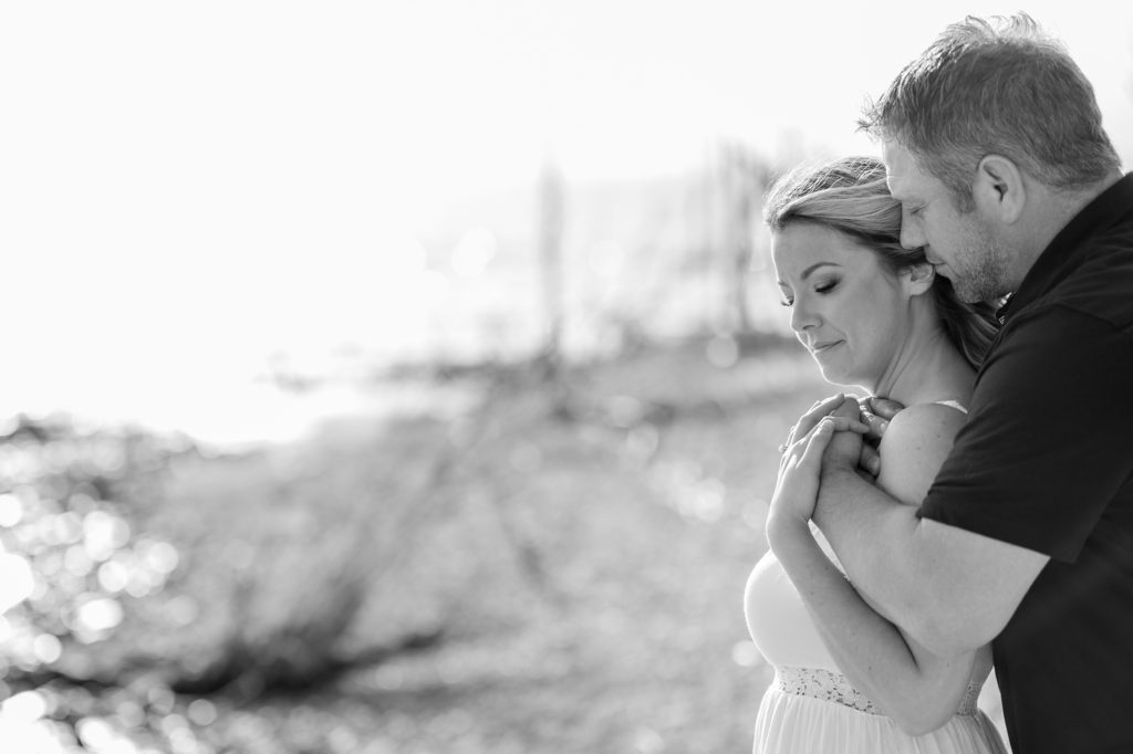 Aiden Laurette Photography | Beach Engagement Photos | Couple's Portrait looking at the lake black and white image.