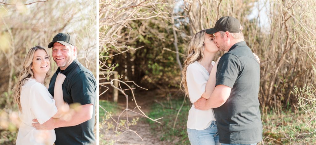 Aiden Laurette Photography | Beach Engagement Photos | Couple's Portrait kissing near a bush 