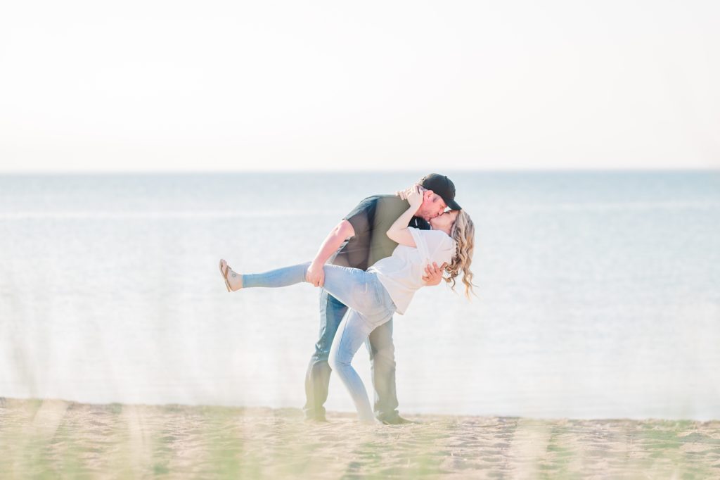 Aiden Laurette Photography | Beach Engagement Photos | Couple's Portrait dip kissing 