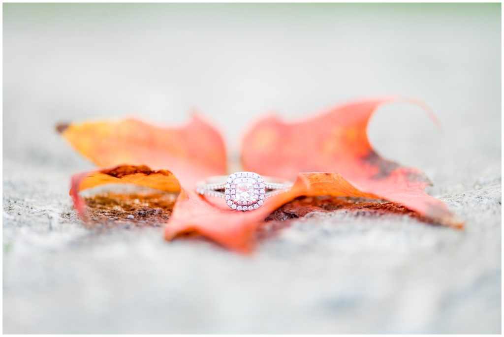 Aiden Laurette Photography | Preparing for an Engagement Session | close up image of a diamond ring on a red maple leaf