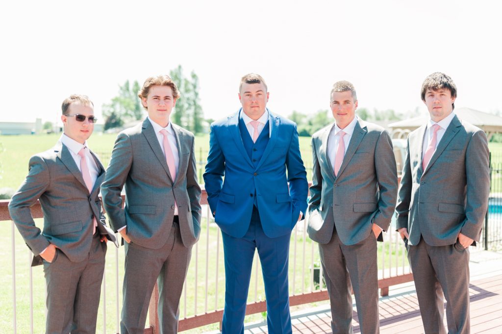 Aiden Laurette Photography | groom and groomsmen pose on balcony