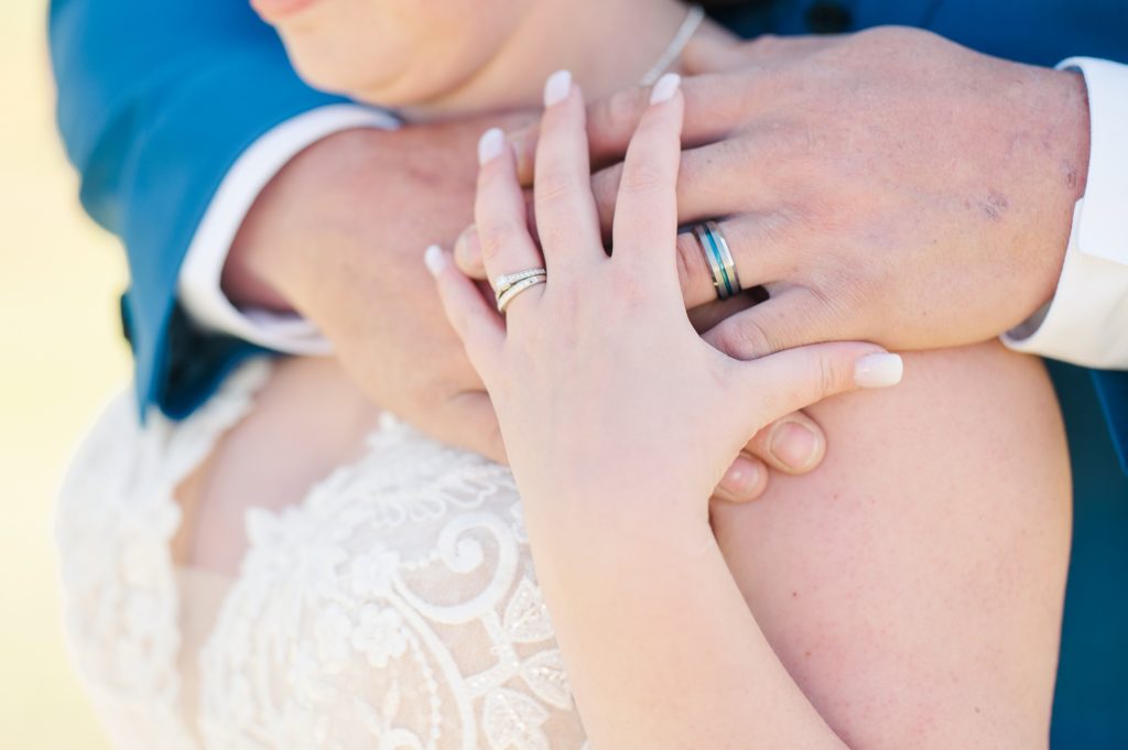 Aiden Laurette Photography | close up photo of wedding rings on bride and grooms hands