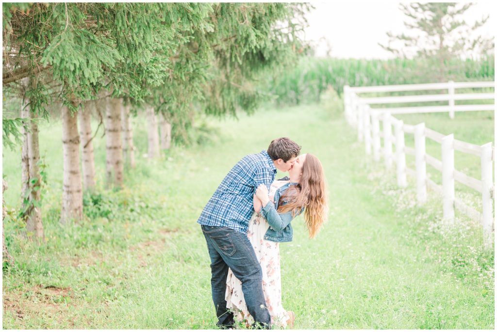 Aiden Laurette Photography | Preparing for an Engagement Session | man and woman kiss in field 