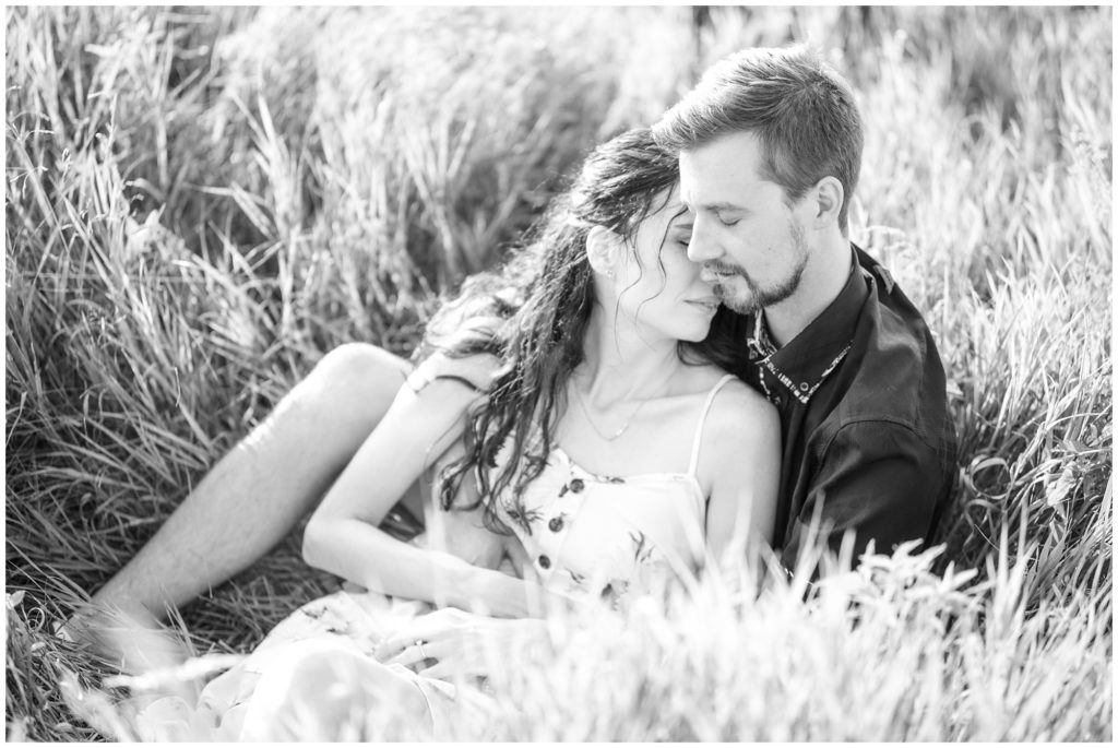 Aiden Laurette Photography | Preparing for an Engagement Session | black and white image of man and woman sitting in grass