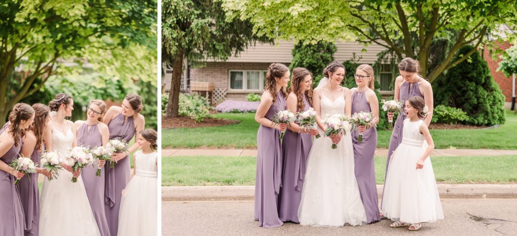 Aiden Laurette Photography | bride poses with flower girl and group of women in purple formal dresses