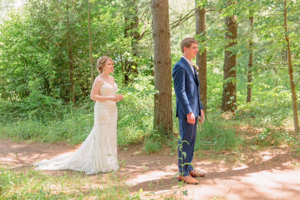 Aiden Laurette Photography | bride stands with groom on trail