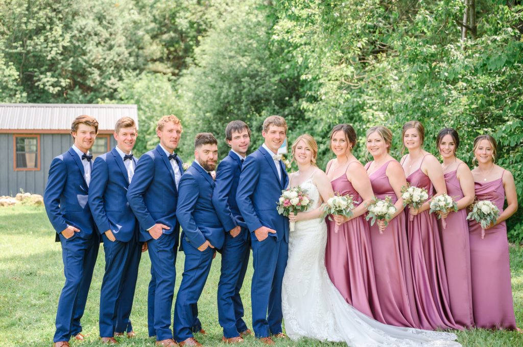 Aiden Laurette Photography | bride and groom pose with bridal party