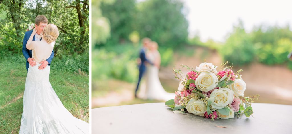 Aiden Laurette Photography | bride and groom pose in greenery; wedding flowers sit on table with bride and groom blurred in the background