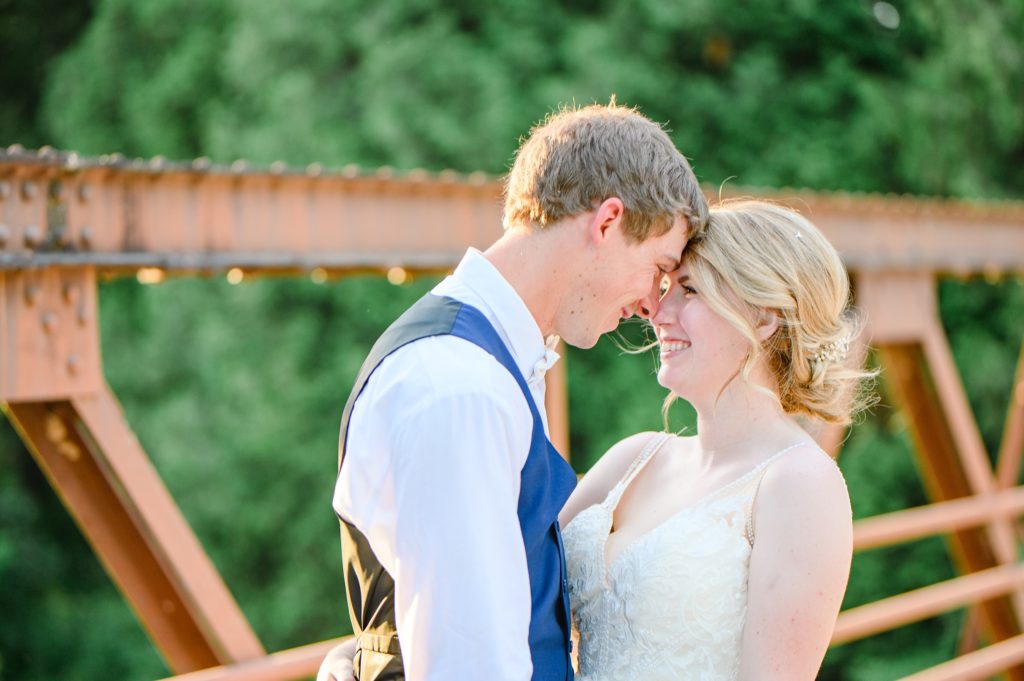 Aiden Laurette Photography | bride and groom look at eachother smiling