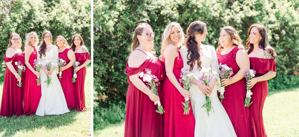 Aiden Laurette Photography | woman in white wedding dress stands and smiles with bridesmaids