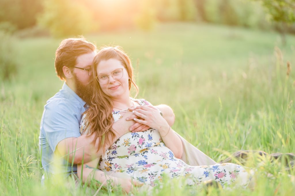 Aiden Laurette Photography | close up of man and woman sitting in field 