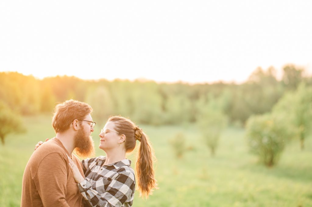 Aiden Laurette Photography | man and woman embracing in field