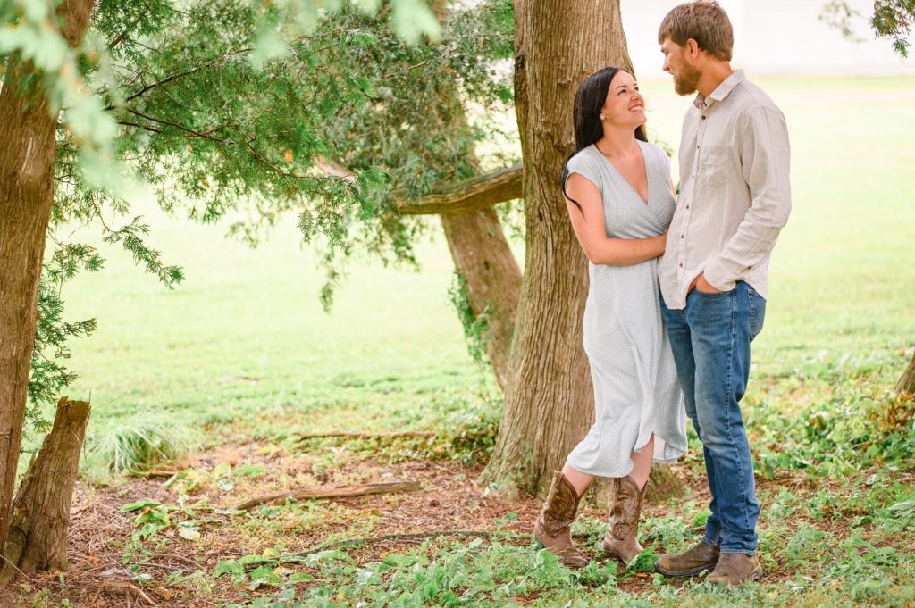 Aiden Laurette Photography | Man and woman embrace in front of tree