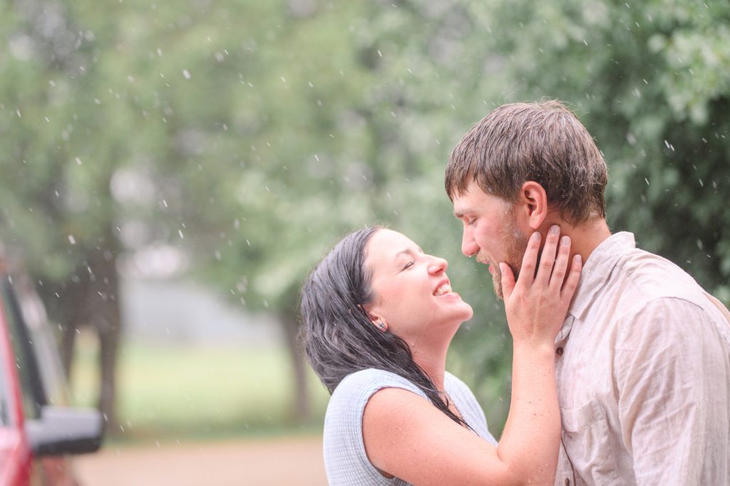Aiden Laurette Photography | man and woman embrace in the rain