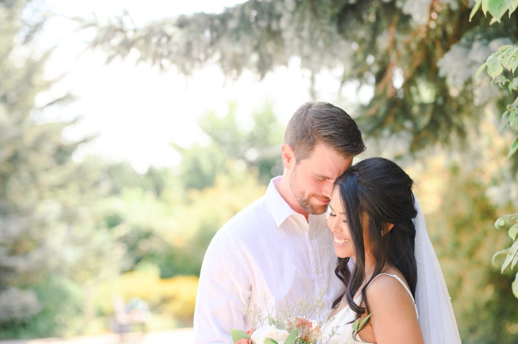 Aiden Laurette Photography | bride and groom embrace under tree