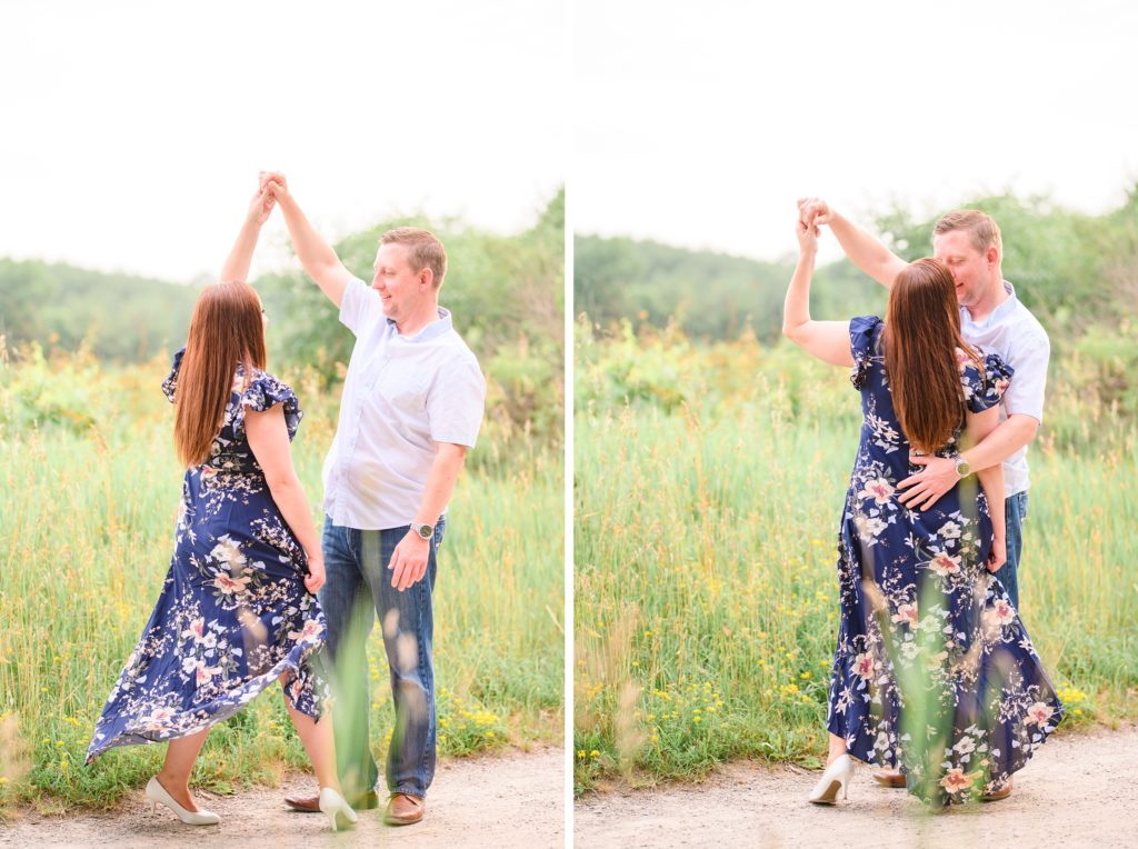 Aiden Laurette Photography | man and woman twirl in front of green field