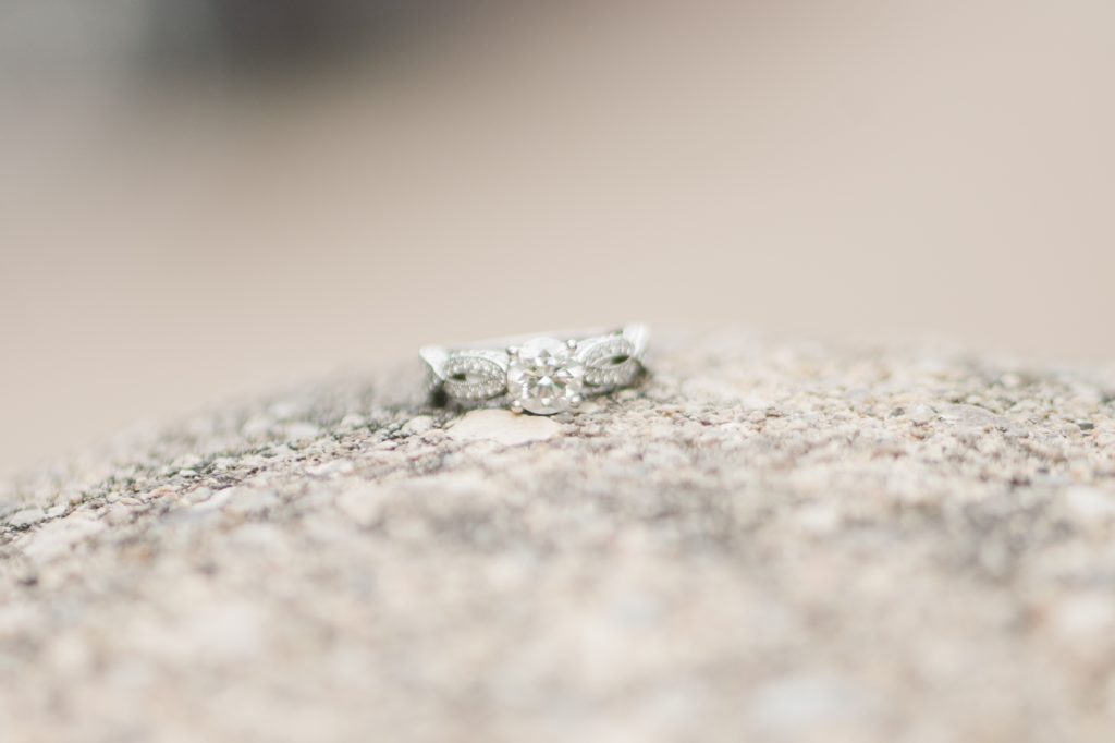 Aiden Laurette Photography | close up photo of engagement ring on rock