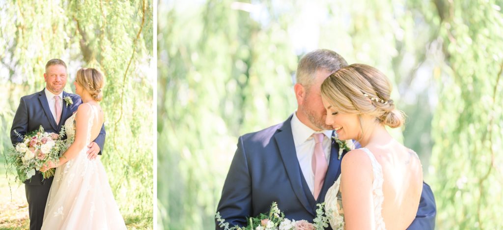 Aiden Laurette Photography | bride and groom pose in field under willow tree