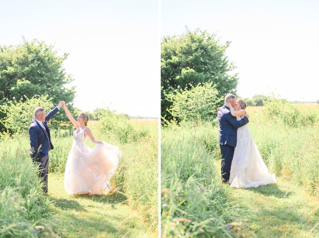 Aiden Laurette Photography | bride and groom pose in field
