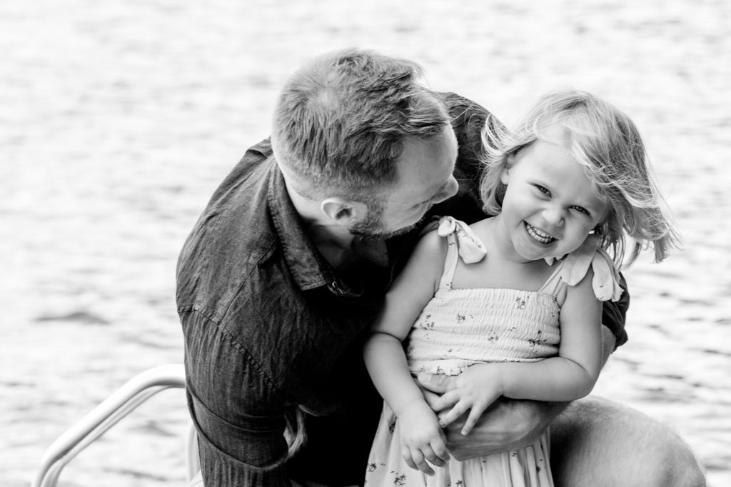 Aiden Laurette Photography | Man and child sit on dock