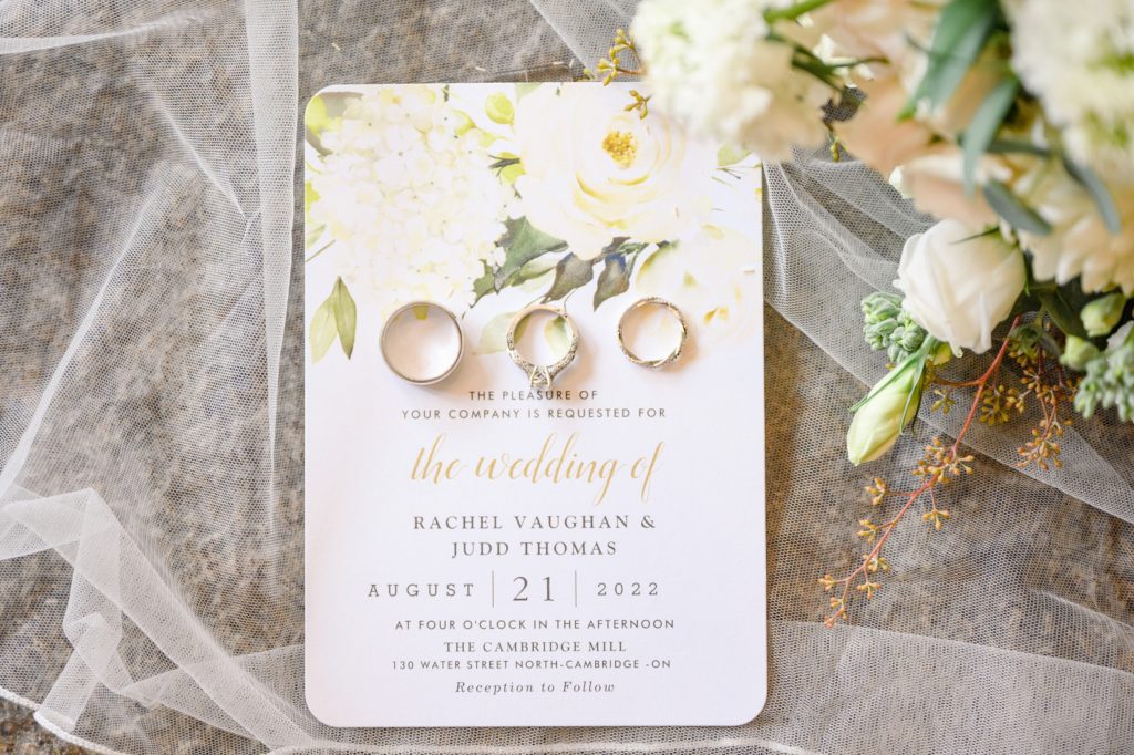 Aiden Laurette Photography | photo of wedding invitation and wedding rings
