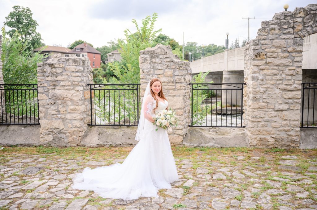 Aiden Laurette Photography | photo of bride standing on rock path