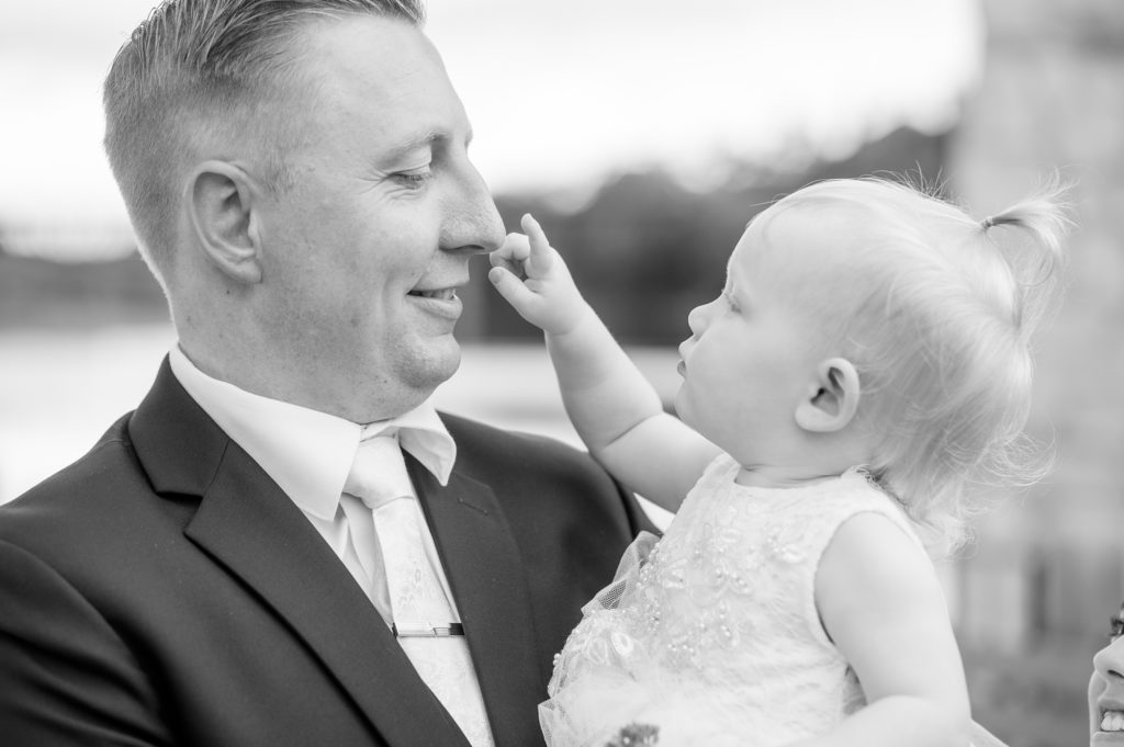 Aiden Laurette Photography | black and white photo of groom and baby
