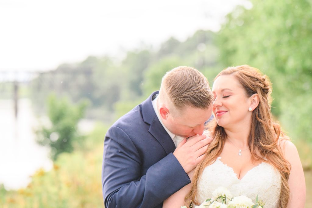 Aiden Laurette Photography | bride and groom kissing