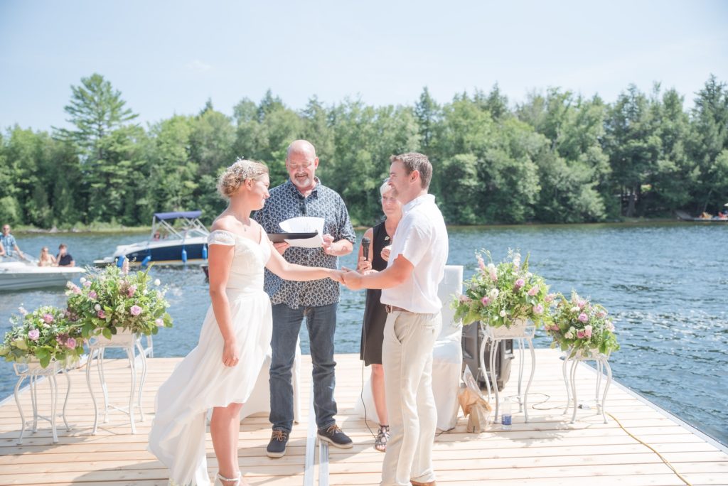 Aiden Laurette Photography | bride and groom stand on dock as they marry