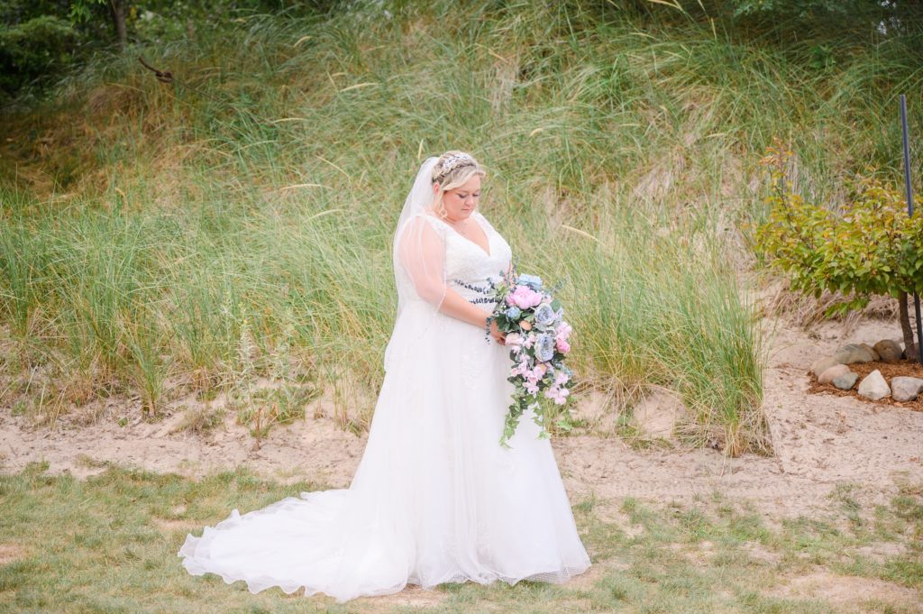 Aiden Laurette Photography | bride posing on beach