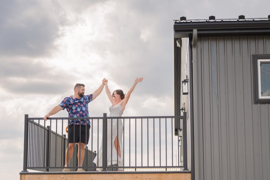 Aiden Laurette Photography | bride and groom pose on balcony