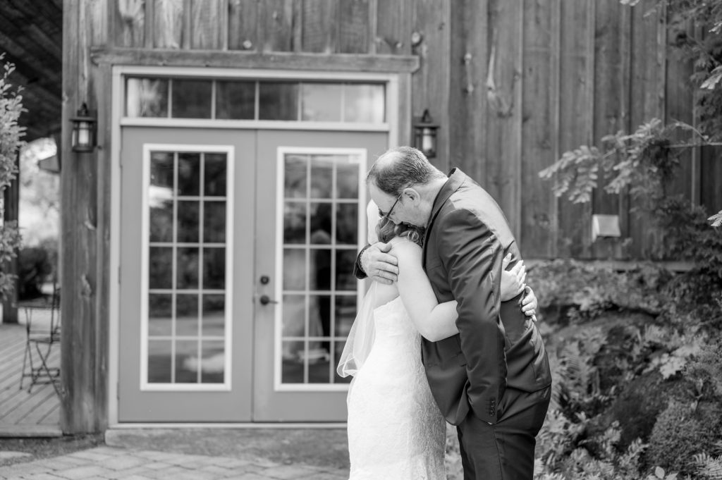 Aiden Laurette Photography | bride hugs man in suit