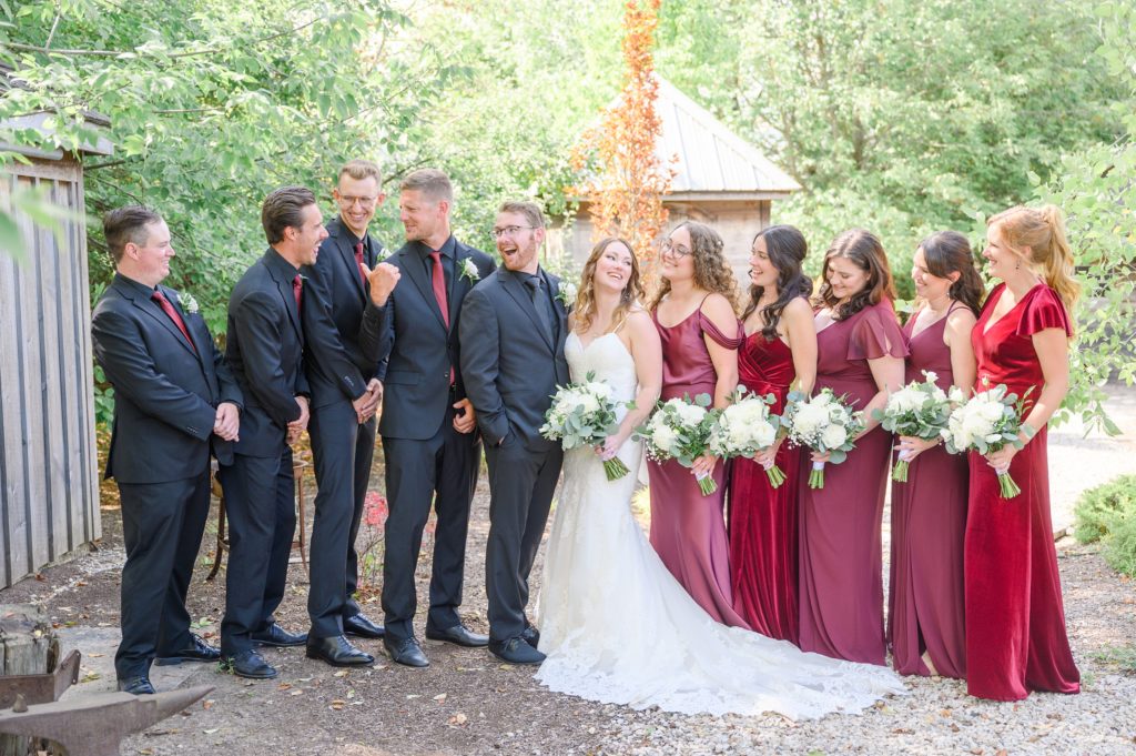 Aiden Laurette Photography | bride and groom pose with bridesmaids and groomsmen