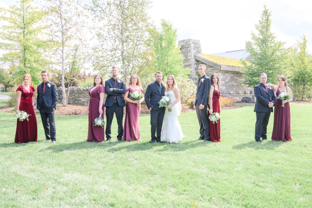 Aiden Laurette Photography | bride and groom pose with bridesmaids and groomsmen