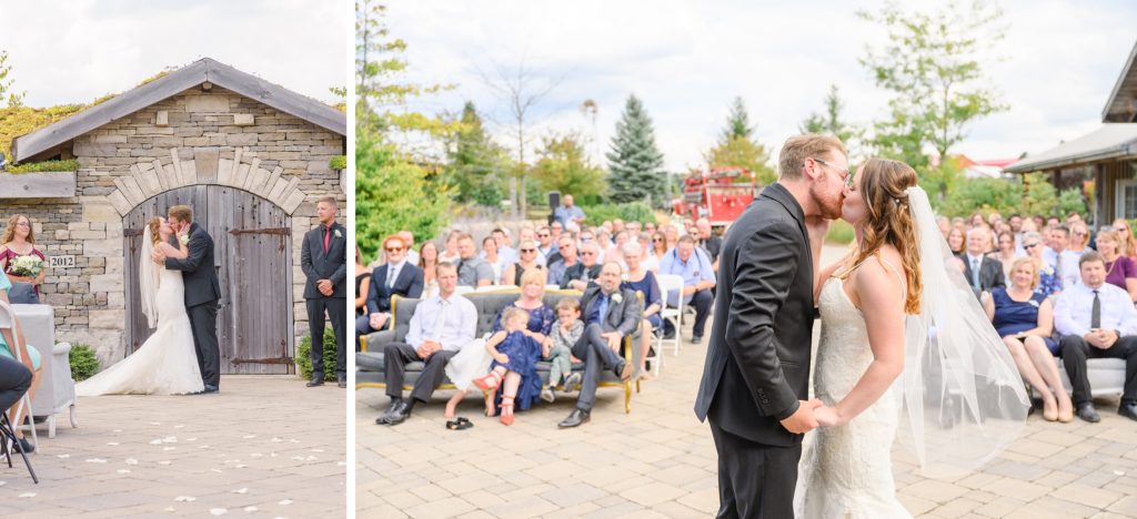 Aiden Laurette Photography | bride and grooms first kiss as wedding guests look on