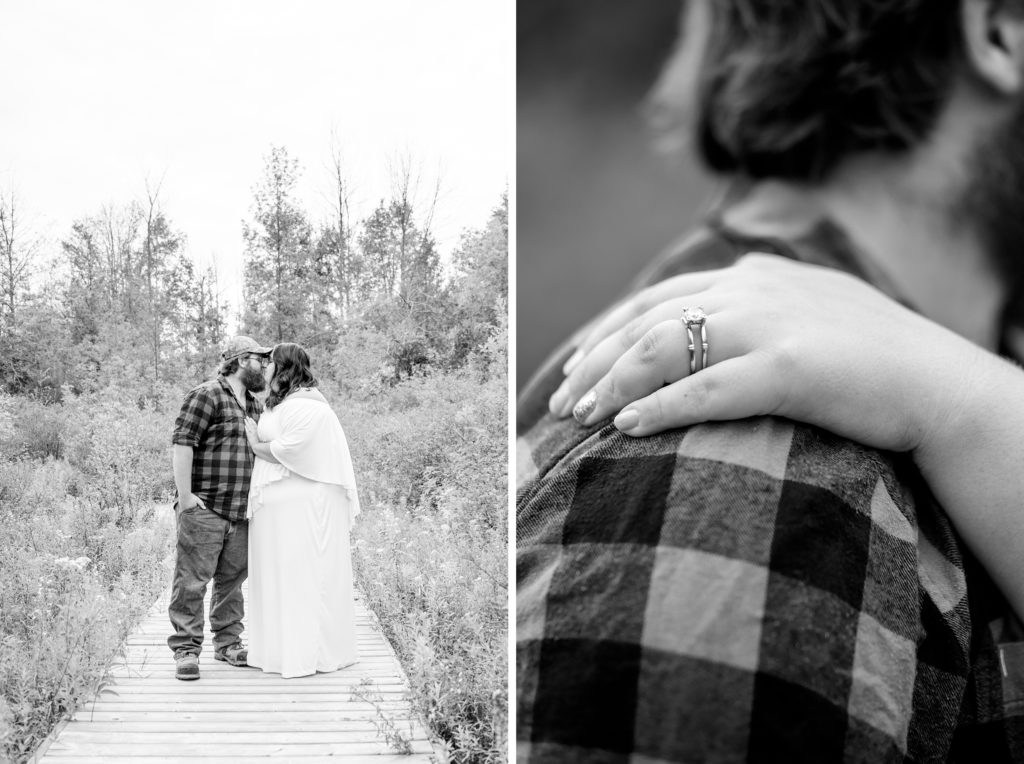 Aiden Laurette Photography | Woman in white dress and man in plaid shirt kiss on path, close up photo of hand wearing diamond ring on mans shoulder