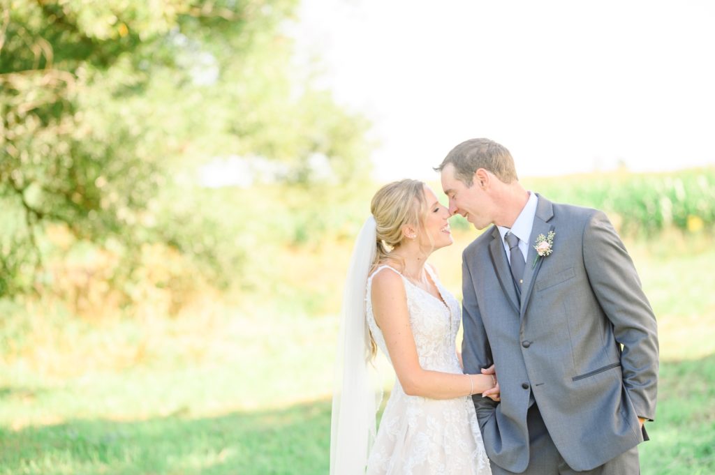 Aiden Laurette Photography | bride and groom embrace