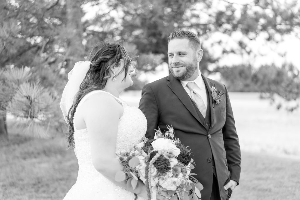 Aiden Laurette Photography | bride and groom pose rose chapel london ontario