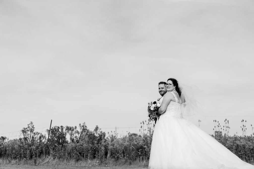 Aiden Laurette Photography | bride and groom pose rose chapel london ontario