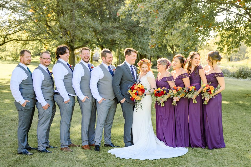 Aiden Laurette Photography | Bride and groom pose with wedding party at st mary's golf and country club