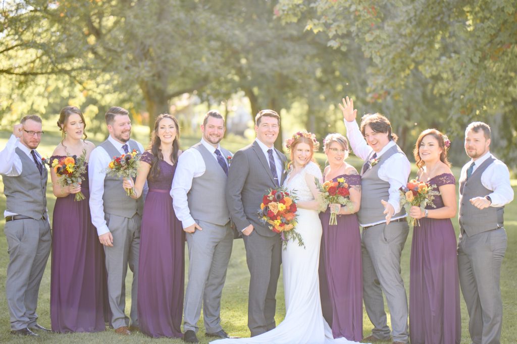 Aiden Laurette Photography | Bride and groom pose with wedding party at st mary's golf and country club