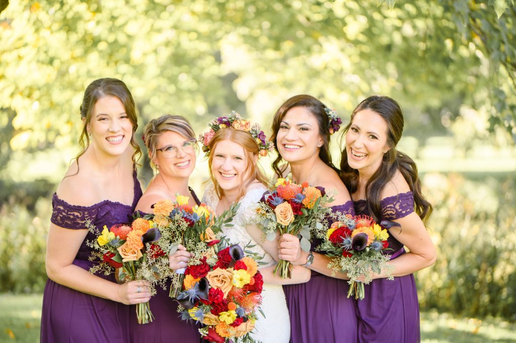 Aiden Laurette Photography | Bride poses with bridesmaids at st mary's golf and country club