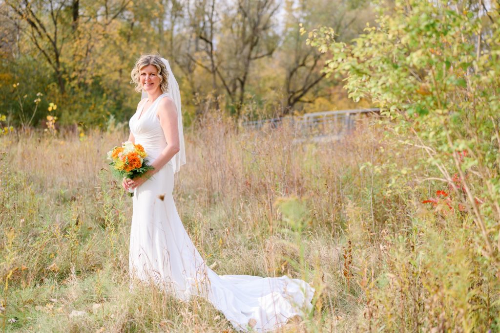 Aiden Laurette Photography | bride poses in field london ontario
