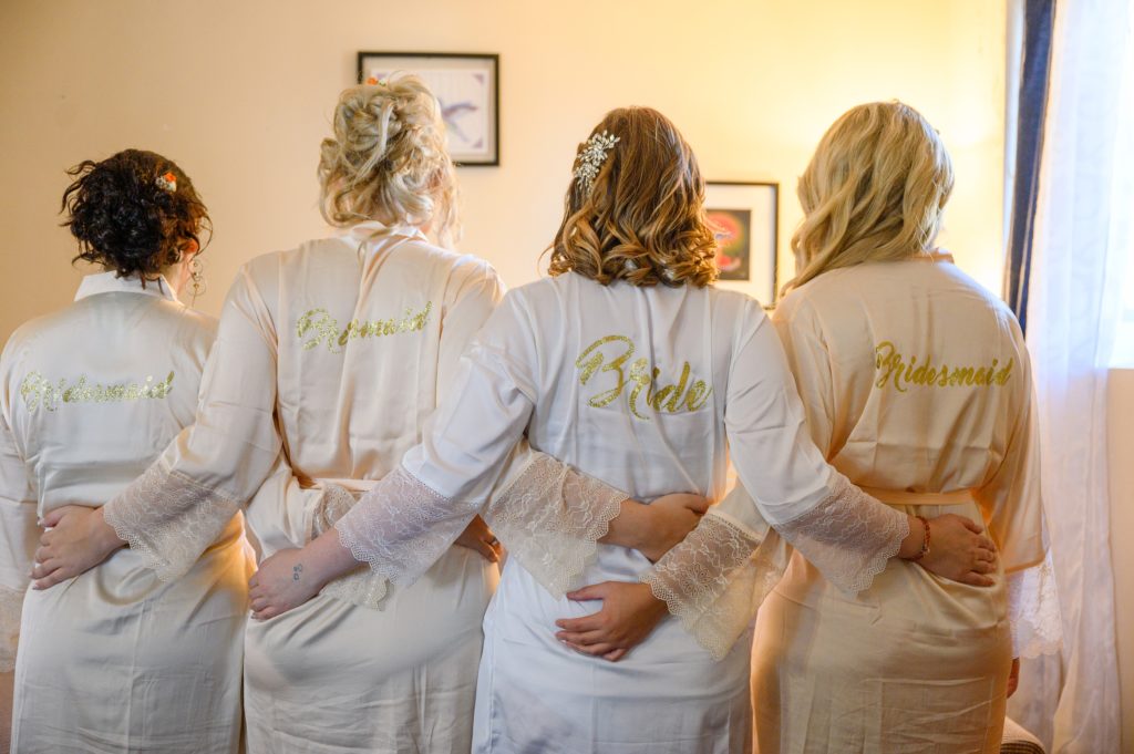 Aiden Laurette Photography | bride poses with bridesmaids